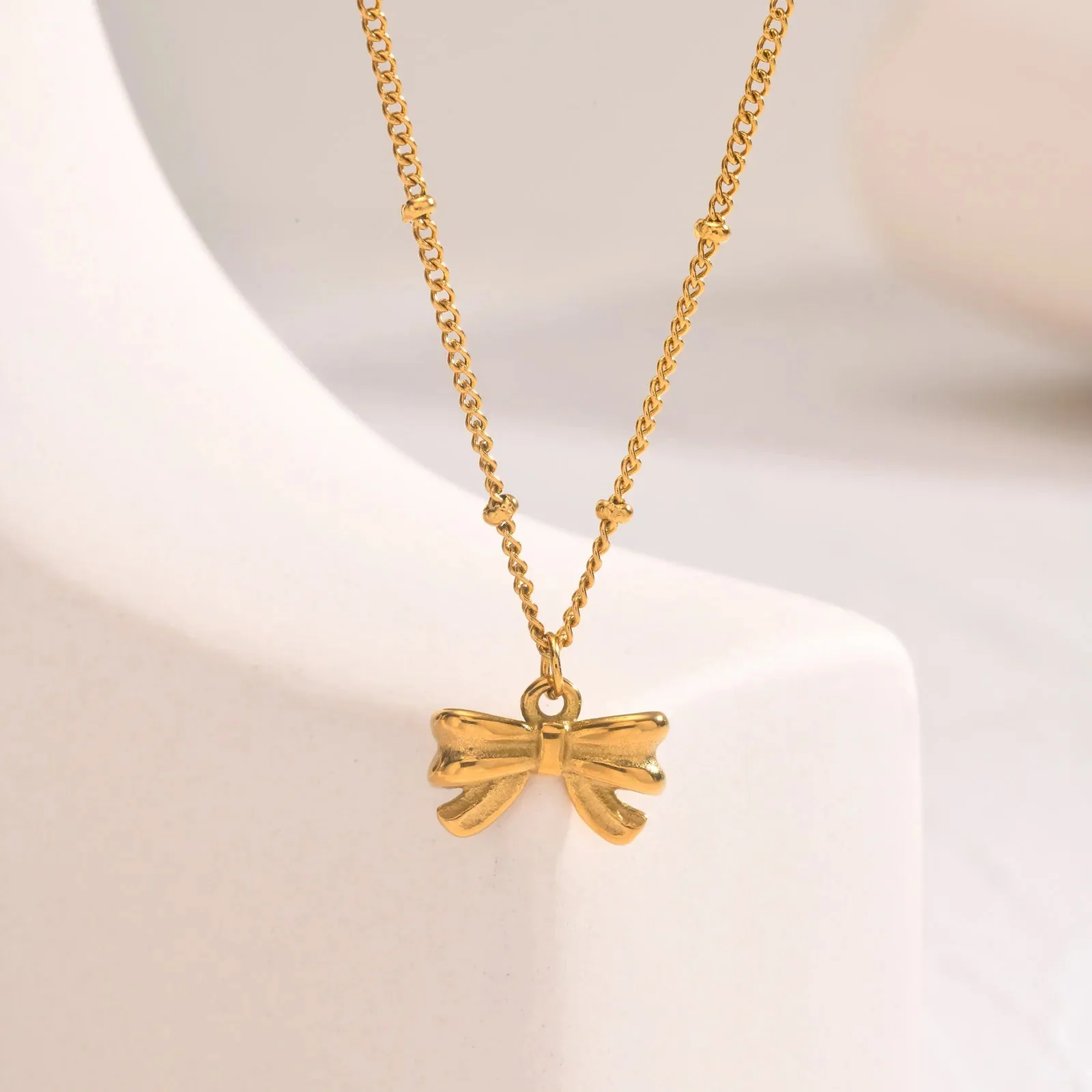 14k Dainty Feminine Bow Necklace - Image 4