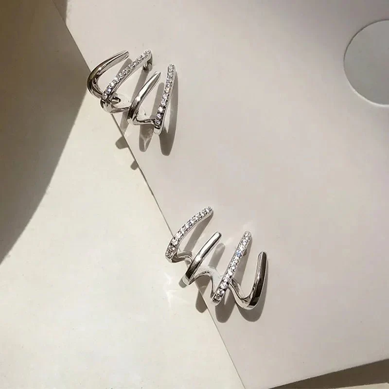 Dainty Shimmering Claw Huggie Earrings - Image 10