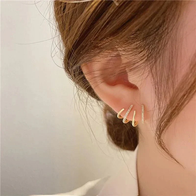 Dainty Shimmering Claw Huggie Earrings - Image 3