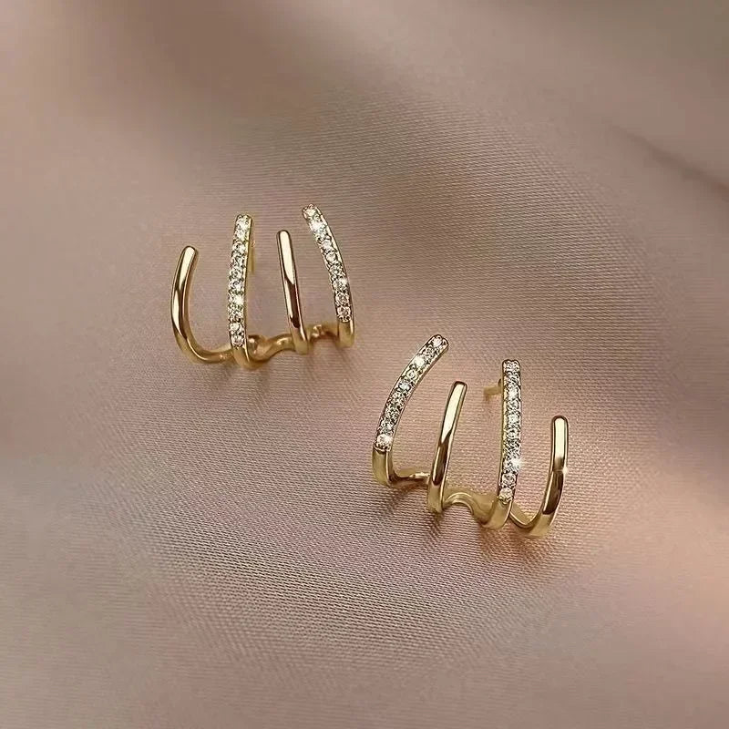 Dainty Shimmering Claw Huggie Earrings - Image 7