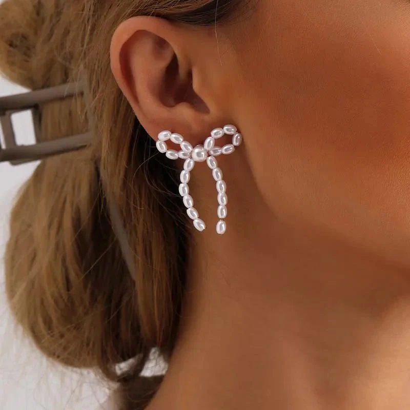 Iconic Dainty Pearl Bow Earrings - Image 4