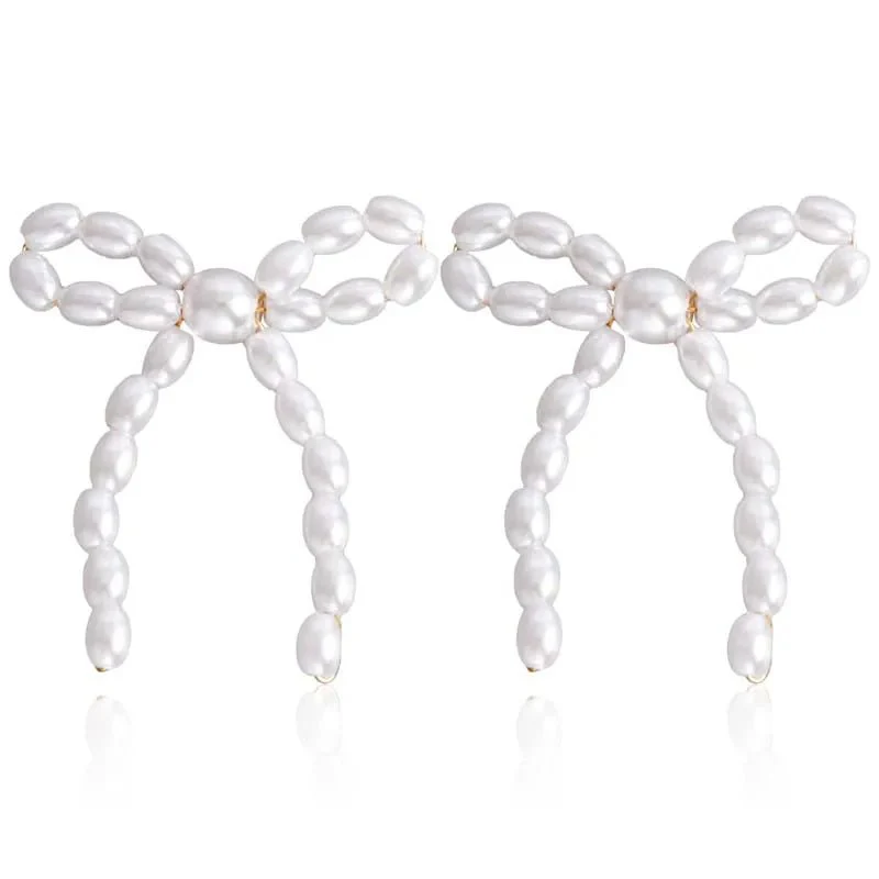 Iconic Dainty Pearl Bow Earrings - Image 8