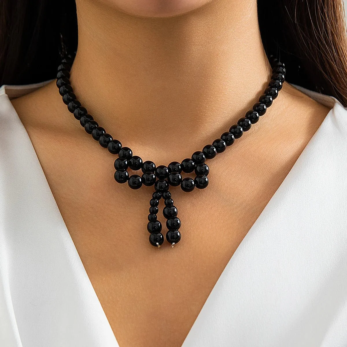 Iconic Dainty Pearl Bow Necklace - Image 4