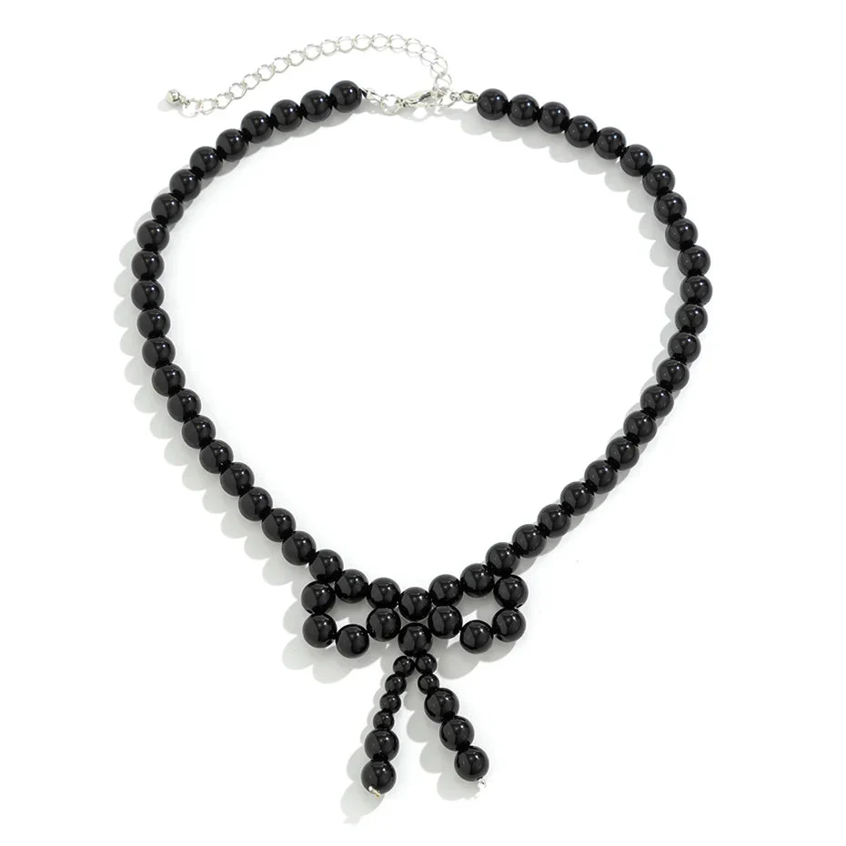 Iconic Dainty Pearl Bow Necklace - Image 9